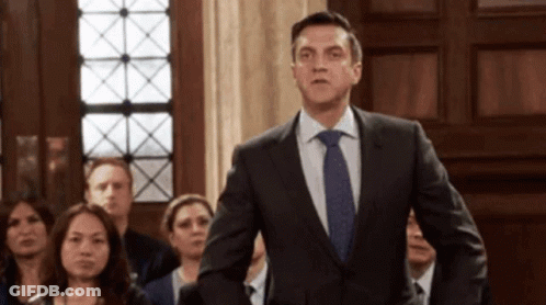 Man In Suit And Tie Before Crowd GIF