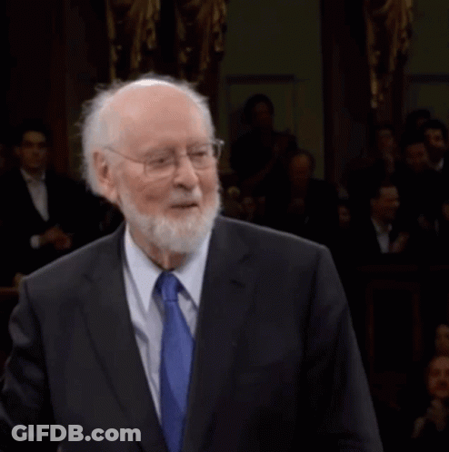 Man In Suit And Tie Before Crowd GIF