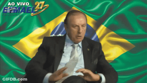 Man In Suit And Tie Before Flag Ao Vivo Emael 21 GIF