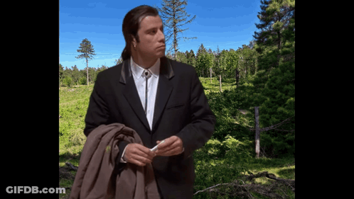 Man In Suit And Tie Before Forest GIF