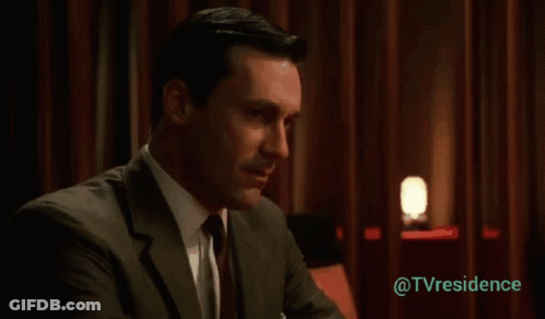 Man In Suit And Tie Before Red Curtain @Tvresidence GIF