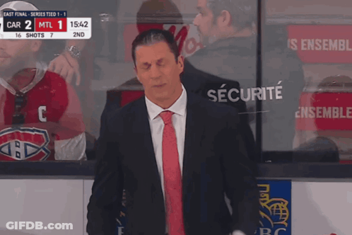Man In Suit And Tie Before Securite Screen GIF