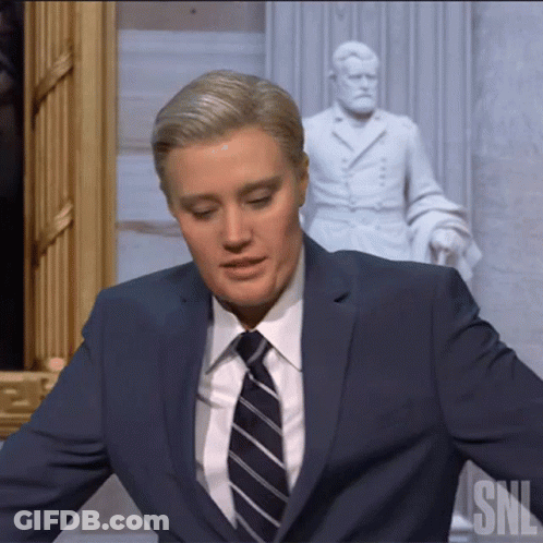Man In Suit And Tie Before SNL Statue GIF