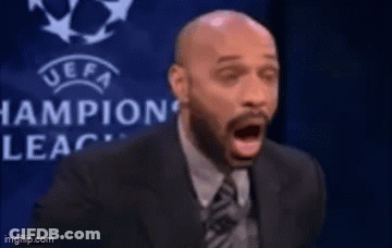 Man In Suit And Tie Before UEFA Logo GIF