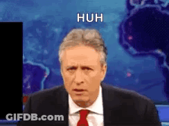 Man In Suit And Tie Before World Map GIF