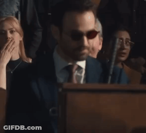 Man In Suit And Tie Behind Podium GIF