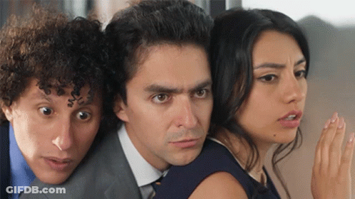 Man In Suit And Tie Between Two Women GIF