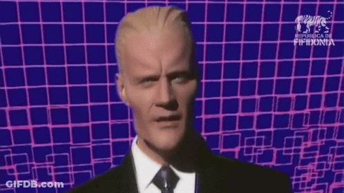 Man In Suit And Tie Blue Pink Checkered Background GIF