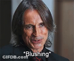 Man In Suit And Tie Blushing GIF