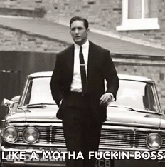 Man In Suit And Tie By Car With Caption Like A Motha Fuckin Boss GIF