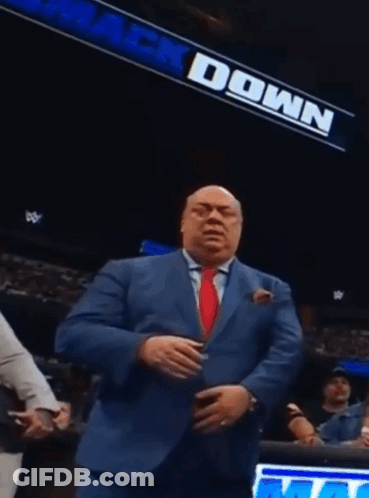 Man In Suit And Tie By Down Sign GIF