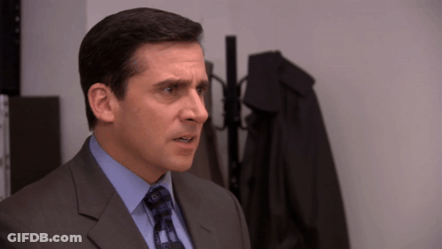 Man In Suit And Tie By Hanger GIF