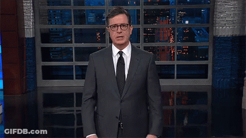 Man In Suit And Tie By Large Window GIF
