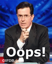 Man In Suit And Tie By Oops Sign GIF