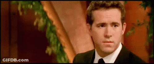 Man In Suit And Tie By Tree GIF