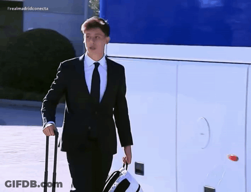 Man In Suit And Tie Carrying Suitcase Realmadridconnecta GIF