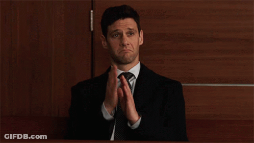 Man In Suit And Tie Clapping GIF