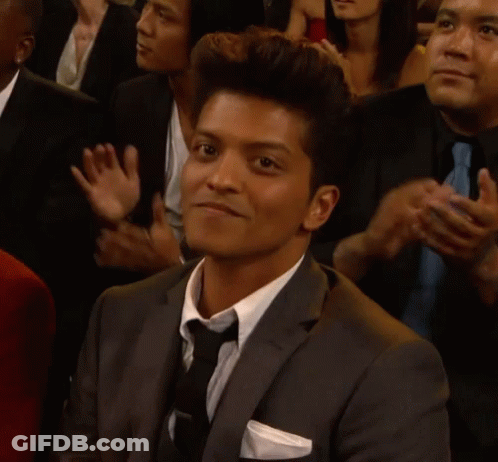 Man In Suit And Tie Clapping In Crowd GIF