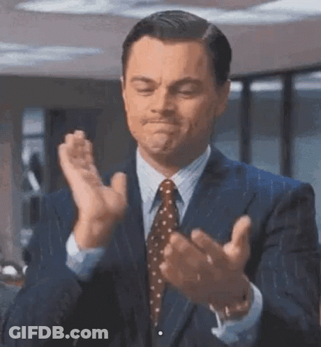 Man In Suit And Tie Clapping GIF