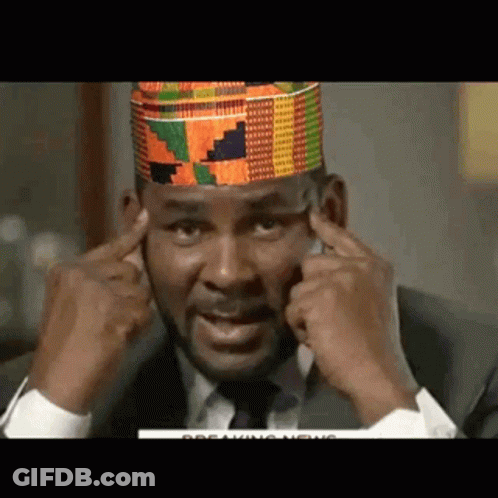 Man In Suit And Tie Covering Ears GIF