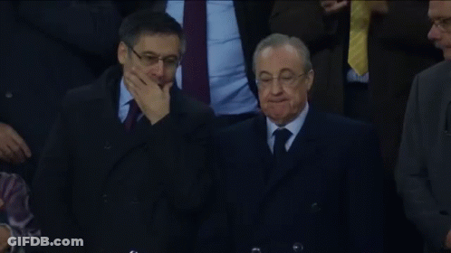 Man In Suit And Tie Covering Mouth GIF