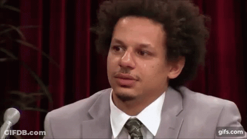 Man In Suit And Tie Crying At Microphone GIF