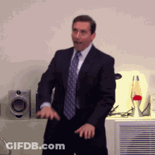 Man In Suit And Tie Dancing GIF