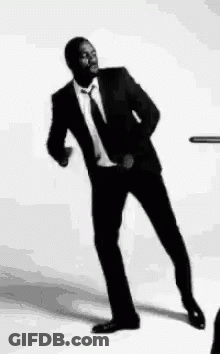 Man In Suit And Tie Dancing GIF