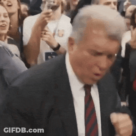 Man In Suit And Tie Dancing In Front Of Crowd GIF
