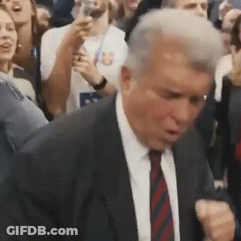 Man In Suit And Tie Dancing In Front Of Crowd GIF