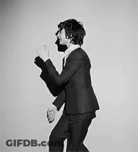 Man In Suit And Tie Dancing GIF