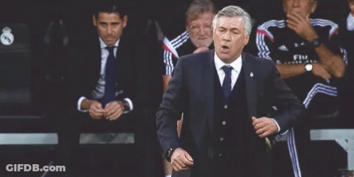 Man In Suit And Tie Dancing Near Seated Men GIF