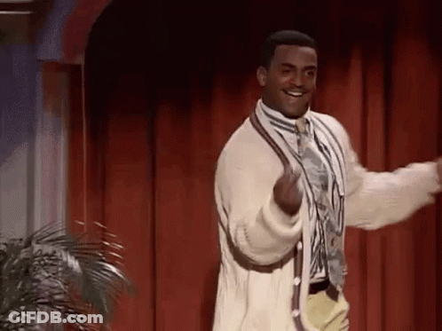 Man In Suit And Tie Dancing On Stage GIF