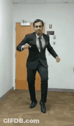Man In Suit And Tie Dancing GIF