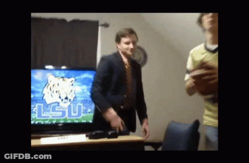 Man In Suit And Tie Dancing With LSU GIF