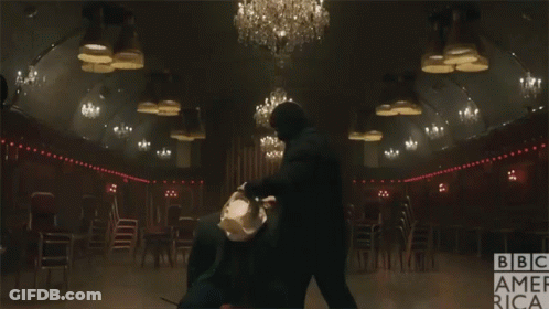 Man In Suit And Tie Dark Room BBC America Logo GIF