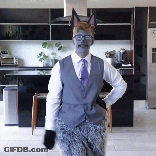 Man In Suit And Tie Dressed As Fox GIF