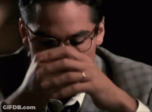 Man In Suit And Tie Drinking From Glass GIF