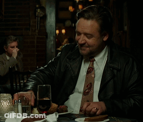Man In Suit And Tie Drinking From Glass GIF