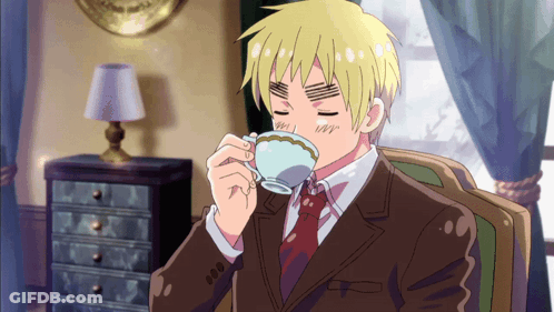 Man In Suit And Tie Drinking From Teacup GIF