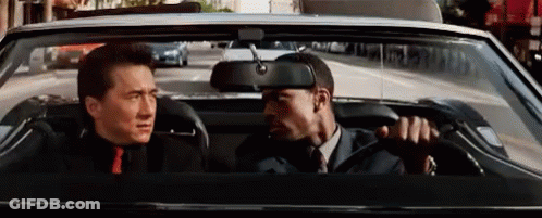 Man In Suit And Tie Driving Car With Backseat Man GIF