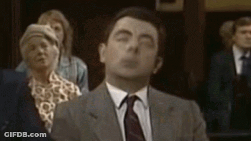Man In Suit And Tie Eyes Closed Crowd GIF