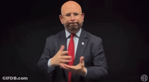 Man In Suit And Tie Gesturing GIF