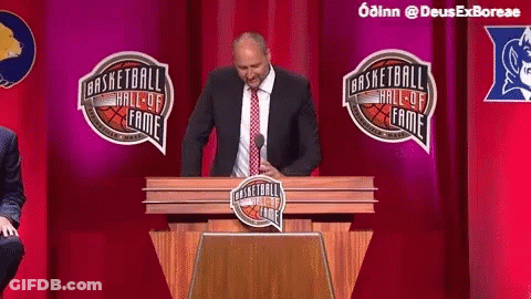 Man In Suit And Tie Giving Speech At Basketball Hall Of Fame GIF
