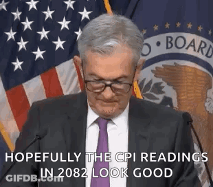 Man In Suit And Tie Giving Speech With American Flag GIF