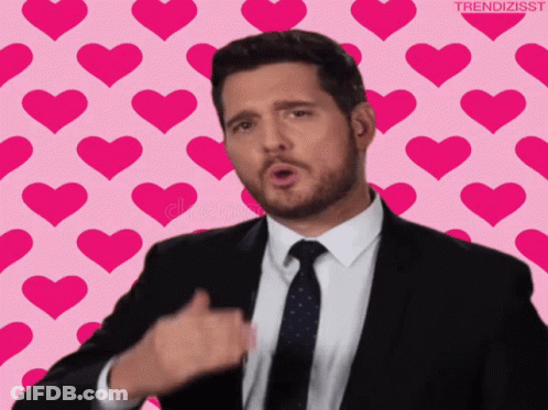 Man In Suit And Tie Giving Thumbs Up With Hearts GIF