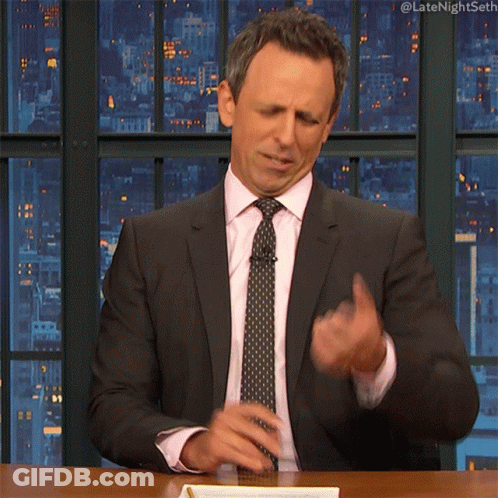 Man In Suit And Tie Hands On Face GIF