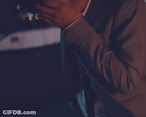 Man In Suit And Tie Holding Beer GIF