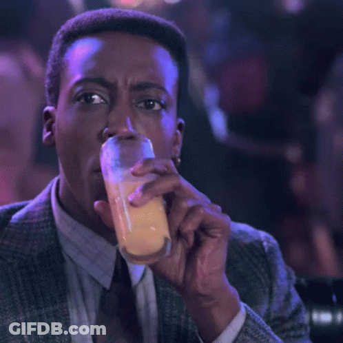 Man In Suit And Tie Holding Beer GIF