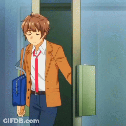 Man In Suit And Tie Holding Blue Bag GIF